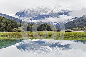 Reflection in lake at Dolimiti mountain. North Italy photo