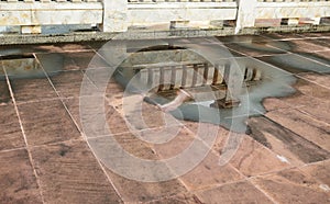 Reflection of Marble Wall in Water Logged