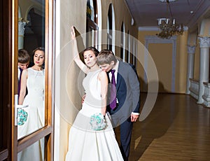 Reflection in the mirror gentle romantic bride and groom