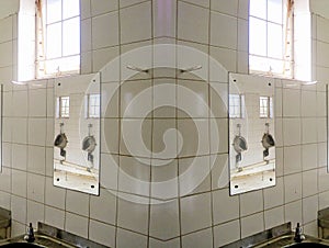 REFLECTION OF MIRRORED URINALS