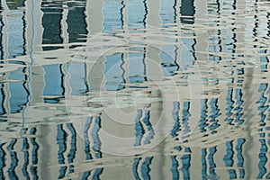 reflection of a modern building on the surface of the water