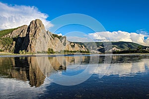 A reflection of a Mongolian Mountain in the evening sun on a river