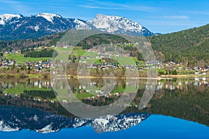 Reflection of mountain village in Hallstatter See, Austria, Europe photo