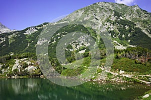 Reflection of Muratov peak in Okoto lake, Pirin Mountain