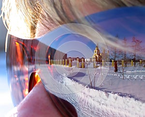 Reflection of Nadym the girl in glasses. The girl's face with gl