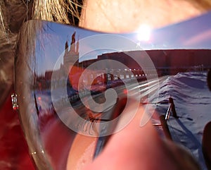 Reflection of Nadym the girl in glasses. The girl's face with gl