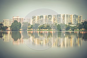 Reflection of new estate HDB housing complex on Jurong Lake, Sin