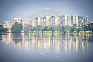 Reflection of new estate HDB housing complex on Jurong Lake, Sin