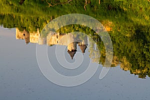 The reflection of Novigrad na Dobri fortress on the Dobra River