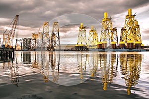 Reflection of offshore wind turbine bases the river Tyne