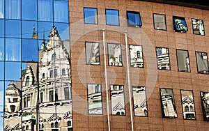 Reflection of old architecture in a new one
