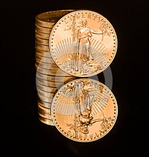 Reflection of one ounce gold coin black