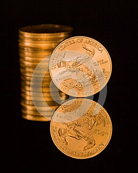 Reflection of one ounce gold coin black