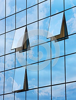 Reflection in open windows of skyscraper