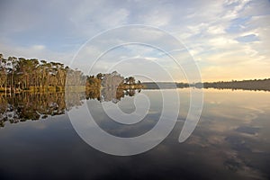 Reflection over lake with sunrise photo