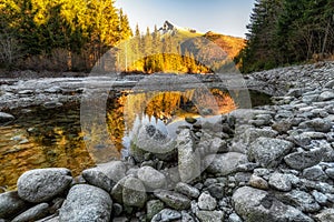 Reflection of peak Krivan in mountain stream, Slovakia
