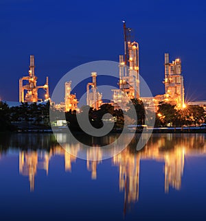 Reflection of petrochemical industry on sunset sky