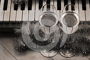 Reflection of piano keys in two wine glasses, pianoforte