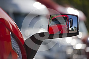 Reflection of the red truck in modern style mirror