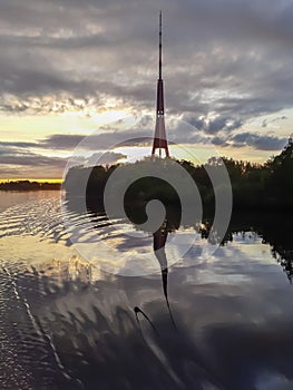 Reflection of Riga TV tower in the waves of Daugava river