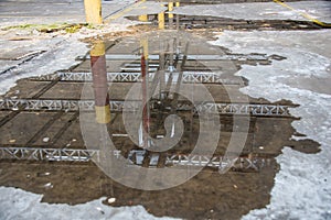 Reflection roof in puddle