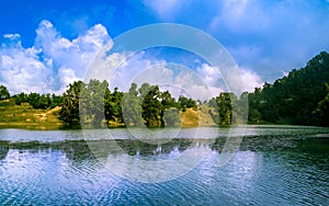 Reflection of serine clouds and sky in the lake.