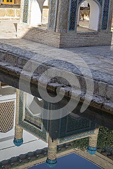Reflection of shrine, in courtyard Bahouddin Nakshband tomb, Bukhara, Uzbekistan photo