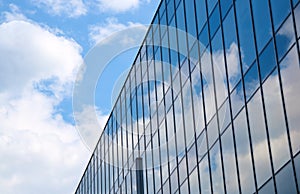 Reflection of the sky and clouds in Glass facade of a building