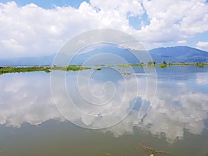 reflection of the sky with mauntain background