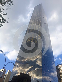 The reflection of the sky in the window of skyscraper