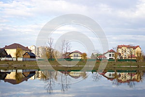 Reflection of a spring or autumn landscape in a city lake