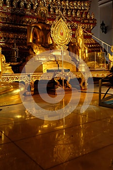 Reflection of Subduing Mara Buddha image and talipot fan of Wat Nah Phramen