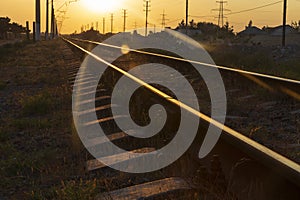 Reflection of the sun on the rails at sunset