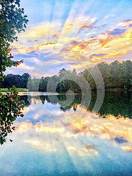 Reflection of a Sunrise Over a Lake