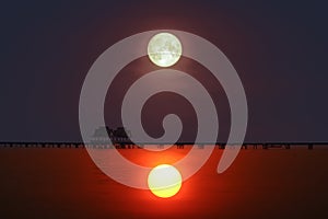 reflection of sunset  silhouette bridge and pavillion in sea and full moon on sky