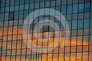 Reflection of sunset sky on the building windows