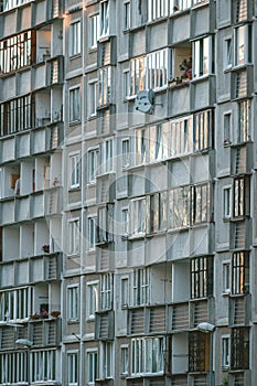 Reflection of a sunset in Soviet multistory building windows in Riga, Latvia