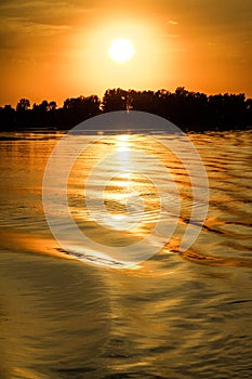 Reflection of the sunset on the watery surface.