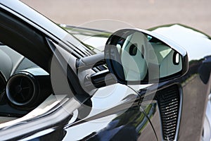 Reflection in supercar door mirror