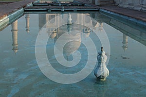 Reflection of the Taj Mahal on a garden pool, Agra, India