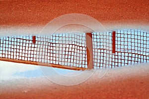 Reflection of tennis net in pool
