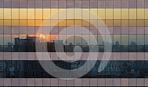 Reflection Of Twilight Sunset Cityscape Scene On Windows Of Skyscraper