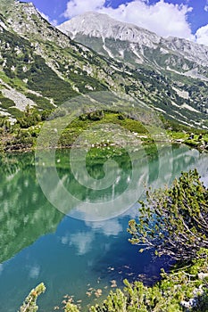 Reflection of Vihren peak in Okoto lake, Pirin Mountain