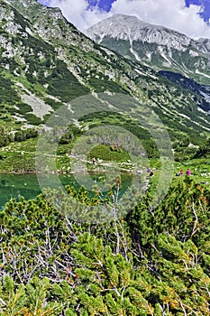 Reflection of Vihren peak in Okoto lake, Pirin Mountain