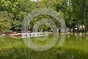 Reflection in the water of boats in the park D. Carlos I, in Caldas da Rainha, Portugal photo