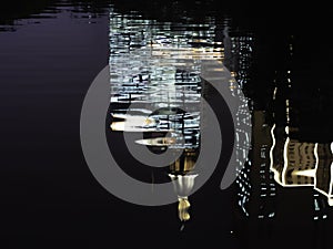 Reflection of water in office building lit at night