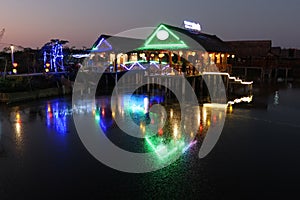 Reflection in the water of a restaurant on the bank of the Thu Bon river in Hoi An