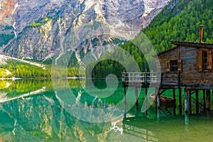 Reflection on water of wonderful Lake Braies, Italian Alps photo