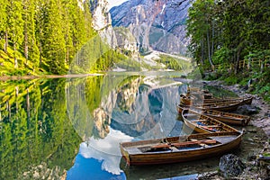 Reflection on water of wonderful Lake Braies, Italian Alps photo