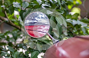 Reflection of windshield wiper on red vintage car